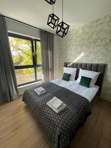 Posteľ alebo postele v izbe v ubytovaní Browarna 12 - Luxury Apartments