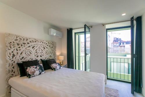 En eller flere senge i et værelse på Loulé Luxury Garden W/ AC