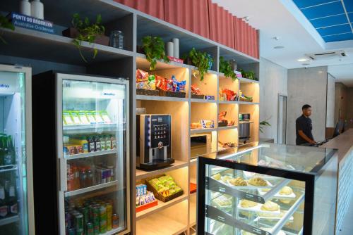 a store with a refrigerator filled with lots of food at ibis budget Rio de Janeiro Centro in Rio de Janeiro