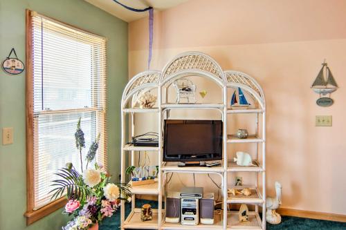 a room with a white shelf with a tv at Kitty Hawk Townhome at Sea Dunes - Walk to Beach! in Kitty Hawk