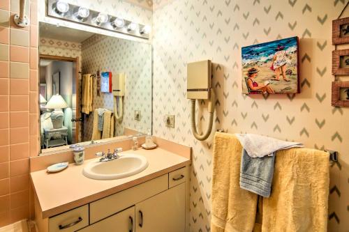 a bathroom with a sink and a mirror at Kitty Hawk Townhome at Sea Dunes - Walk to Beach! in Kitty Hawk