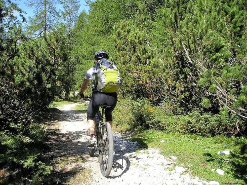 a man riding a bike down a trail at VILLA VALENTINA in Mataró