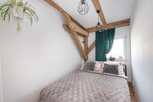 Postel nebo postele na pokoji v ubytování Apartament Mikołowska