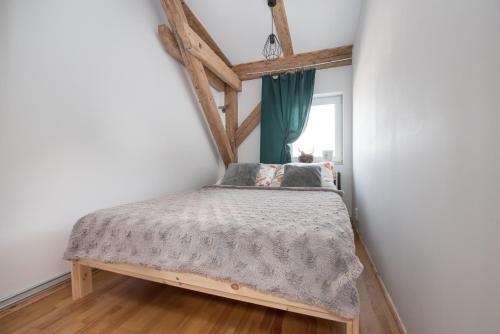 Postel nebo postele na pokoji v ubytování Apartament Mikołowska