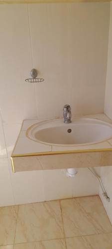 a bathroom with a sink with a faucet at Riad beach house in Mirleft