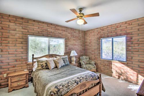 a bedroom with a bed and a ceiling fan at Tucson Home - Hiking Trail Access On-Site! in Avra