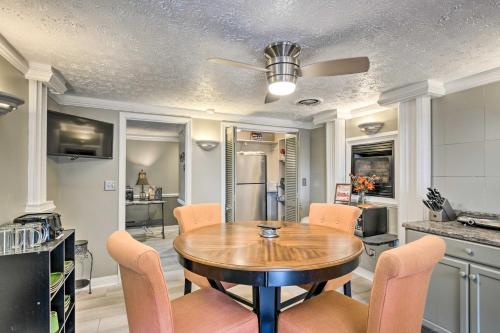 a kitchen and dining room with a wooden table and chairs at Efficiency Apt Shared Conference Room, Patio in Greenville