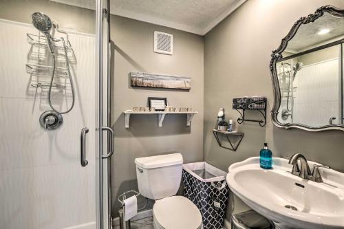 a bathroom with a toilet and a sink and a shower at Efficiency Apt Shared Conference Room, Patio in Greenville