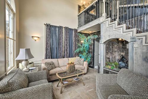 a living room with two couches and a fireplace at Efficiency Apt Shared Conference Room, Patio in Greenville