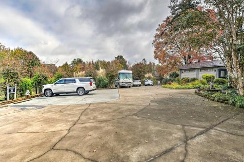 a white car parked in a parking lot at Efficiency Apt Shared Conference Room, Patio in Greenville