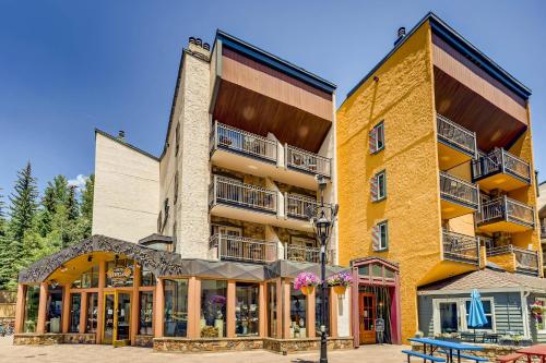 a large yellow building with balconies on it at Lift House Lodge, Pet Friendly, Premium Studio Condo in Vail