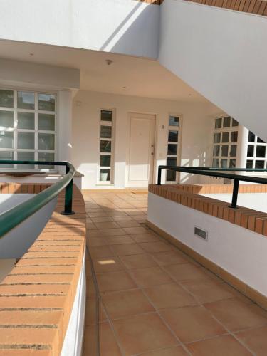 a view of the outside of a building with a staircase at House of Rising Sun in Quarteira