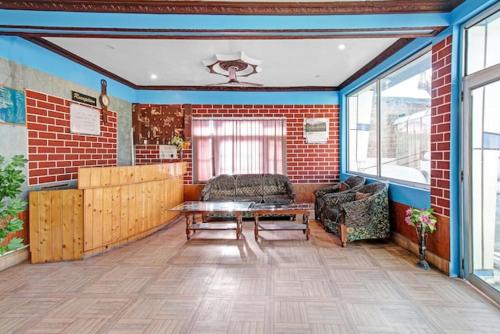 a living room with a couch and a table at Hotel grand City heart in Srinagar
