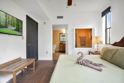 a living room with a couch and a table at Designer 3BR/2BA Corner Suite - Disney & Universal in Orlando