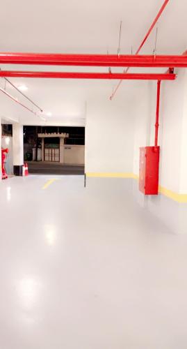 an empty parking lot with a red pole at شقق واي سويت للشقق المخدومة in Abha