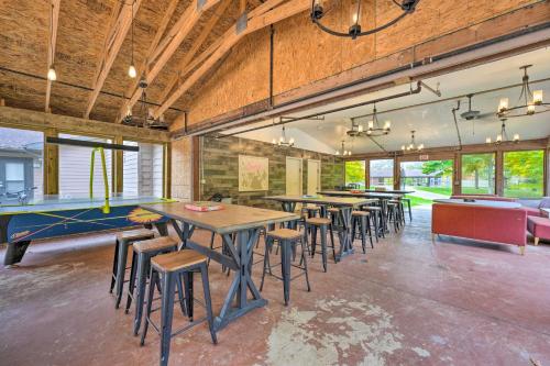a room with tables and chairs and a pool table at Pet-Friendly Cassopolis Escape with Lake Access in Cassopolis