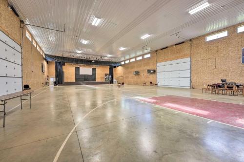 an empty gym with a ping pong court at Pet-Friendly Cassopolis Escape with Lake Access in Cassopolis