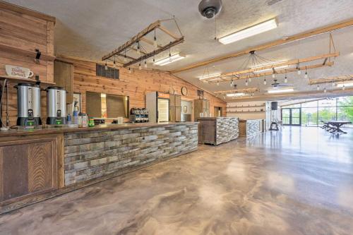a large room with a bar in a building at Pet-Friendly Cassopolis Escape with Lake Access in Cassopolis