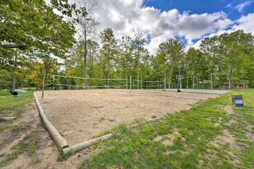 a volleyball court with a net in a park at Pet-Friendly Cassopolis Escape with Lake Access in Cassopolis