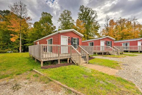 a home with a deck and a house at Cassopolis Cabin, Private Deck and Lake Access! in Cassopolis