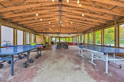 a ping pong room with two ping pong tables at Cassopolis Cabin, Private Deck and Lake Access! in Cassopolis