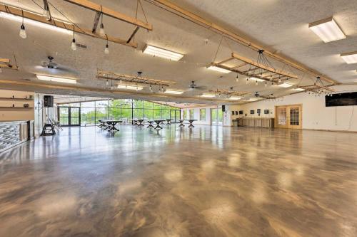a large room with a concrete floor in a building at Cassopolis Cabin, Private Deck and Lake Access! in Cassopolis