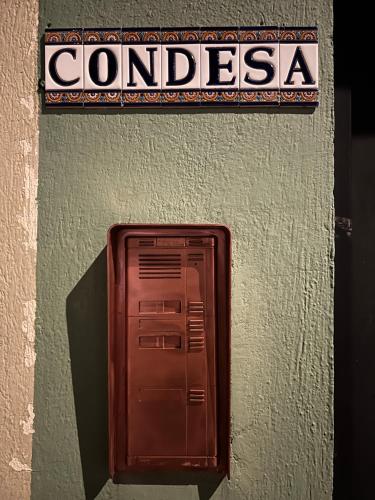 a brown mail box on the side of a building at Condesa in Tirana
