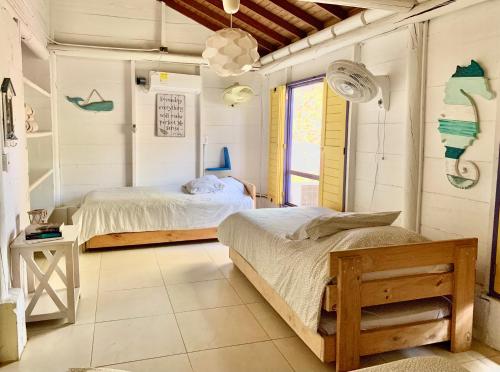 Voodi või voodid majutusasutuse Casita Caribe en reserva natural, playa privada, kayaks, wifi, aire acondicionado toas