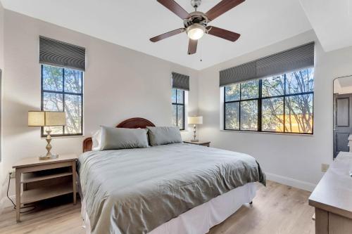 a bedroom with a bed and a ceiling fan at Designer Corner Suite 3BR/2BA -Disney & Universal in Orlando