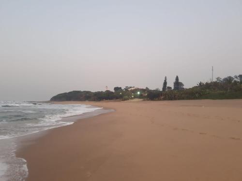 a view of a beach with the ocean at No 12 Tugela Mouth in Tugela Mouth