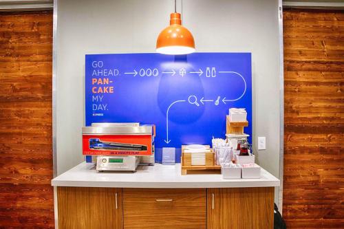 a counter with a blue board with aperature at Holiday Inn Express & Suites Blythe by IHG in Blythe