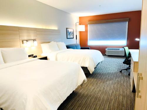 a hotel room with two beds and a desk at Holiday Inn Express & Suites Blythe by IHG in Blythe