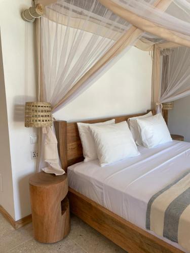 Katil atau katil-katil dalam bilik di Boutique Villa Unaweza