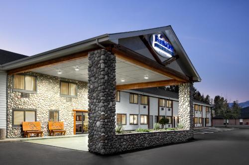 a hotel with a sign on the front of it at Baymont by Wyndham Whitefish in Whitefish