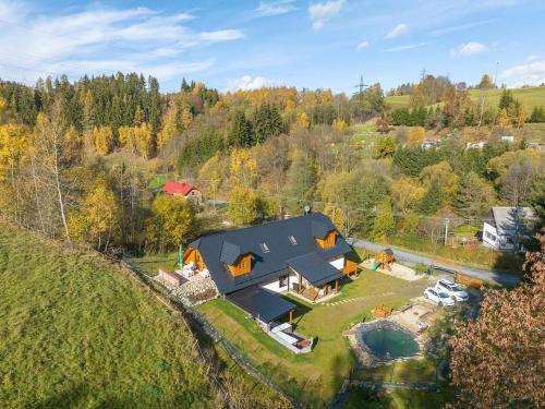 an aerial view of a house on a hill at Chalupa Lilien pod Medvědí skálou Jeseníky in Jindřichov