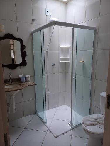 a glass shower in a bathroom with a toilet at Casa_Margarida in Penha