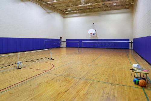 a gym with a basketball court with a ball on the floor at Best Western Parkway Hotel Toronto North in Richmond Hill
