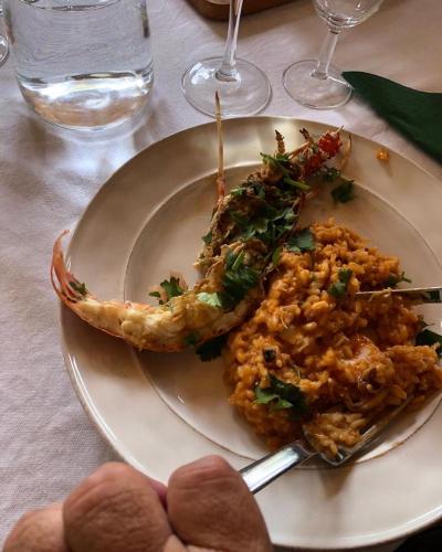 a plate of food with shrimp and rice on a table at Quintinha da Oliveira in Marco de Canavezes