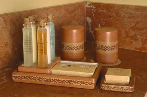 a group of bottles and a box on a table at Sanctuary Lodge, A Belmond Hotel, Machu Picchu in Machu Picchu