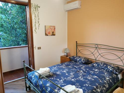 A bed or beds in a room at Villa Iris - Mondello