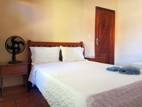 Ένα ή περισσότερα κρεβάτια σε δωμάτιο στο Pousada Paraíso das Falésias