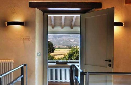 a door to a room with a view of a window at Country House Casco Dell'Acqua in Trevi