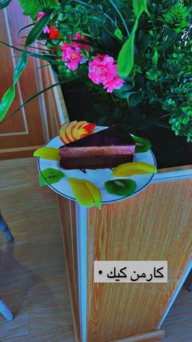 a plate with food on top of a plant at فندق ادوماتو ADOMATo HOTEl in Dawmat al Jandal