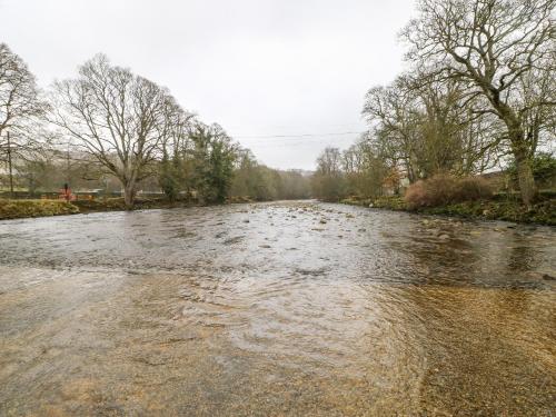 a river with water in the middle at Flat Above 27 in Bishop Auckland