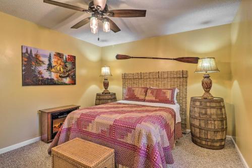 a bedroom with a bed and a ceiling fan at Creekside Retreat with Deck, 18 Miles to Wolf Ridge in Weaverville