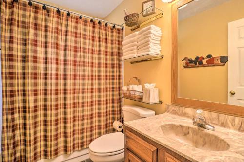 a bathroom with a sink and a toilet and a shower at Creekside Retreat with Deck, 18 Miles to Wolf Ridge in Weaverville