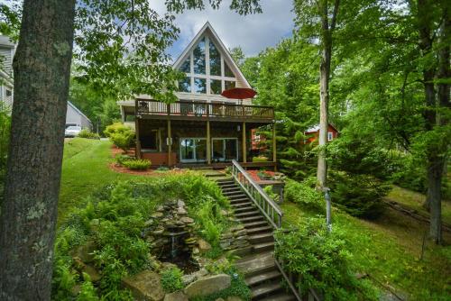 a house with a staircase leading up to a house at Dreamers Inn in Swanton