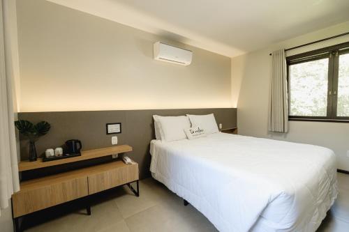 Postel nebo postele na pokoji v ubytování Malbec Casa Hotel
