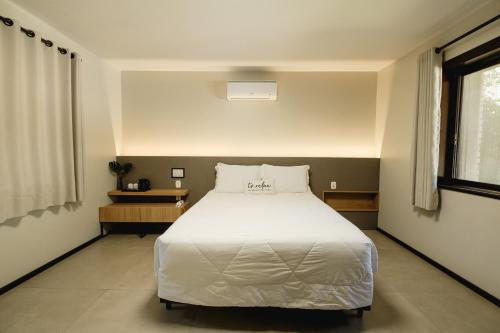 Postel nebo postele na pokoji v ubytování Malbec Casa Hotel