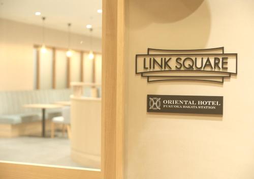 a sign on the door of a furniture store at Oriental Hotel Fukuoka Hakata Station in Fukuoka